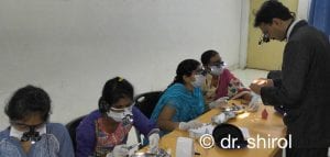 dr dayanand shirol1 Dr Dayanand teaching students with loupes
